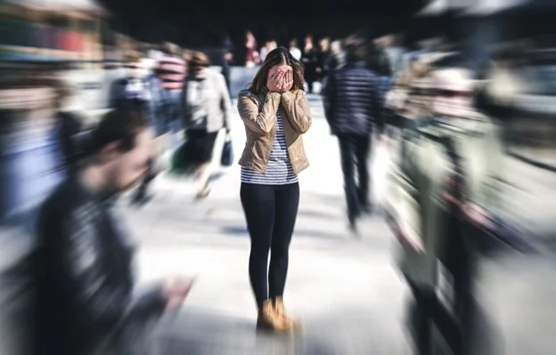 A female employee exhibiting symptoms of stress whilst not at work, due to workplace problems.