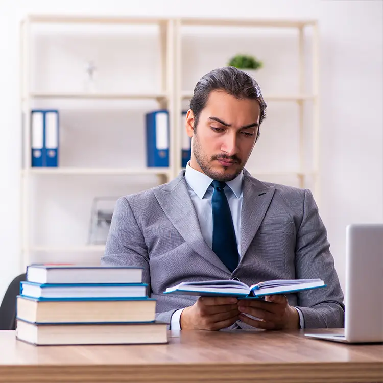 a man reading a book on grievances