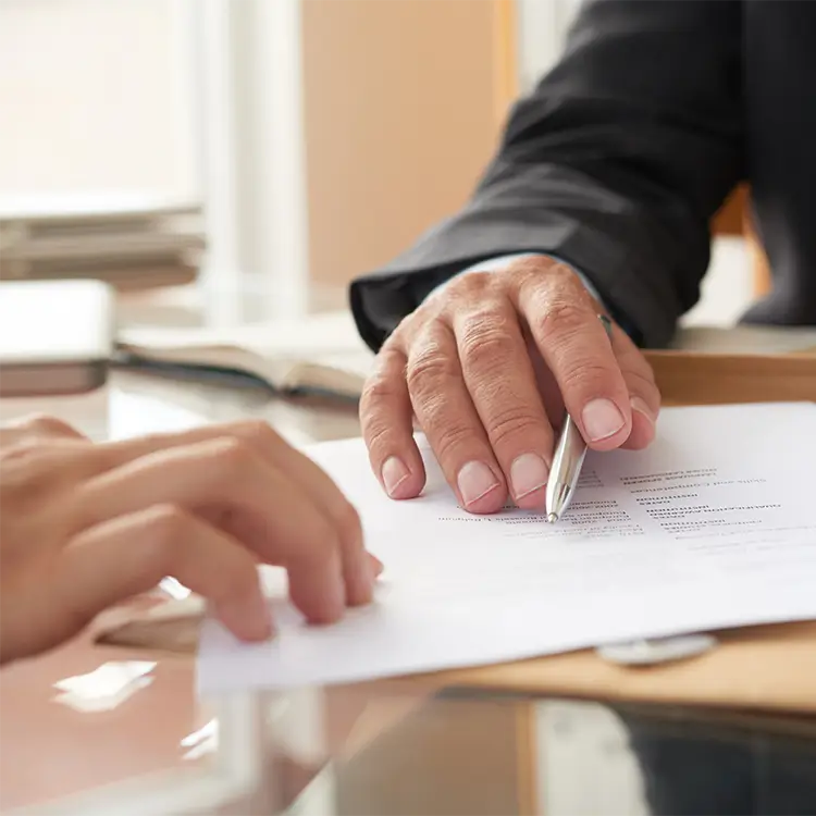 employer showing an employee where to sign